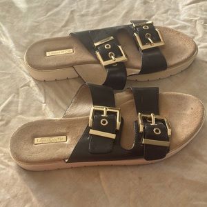 Black sandals with double gold buckle straps with 1inch heel. Only worn twice